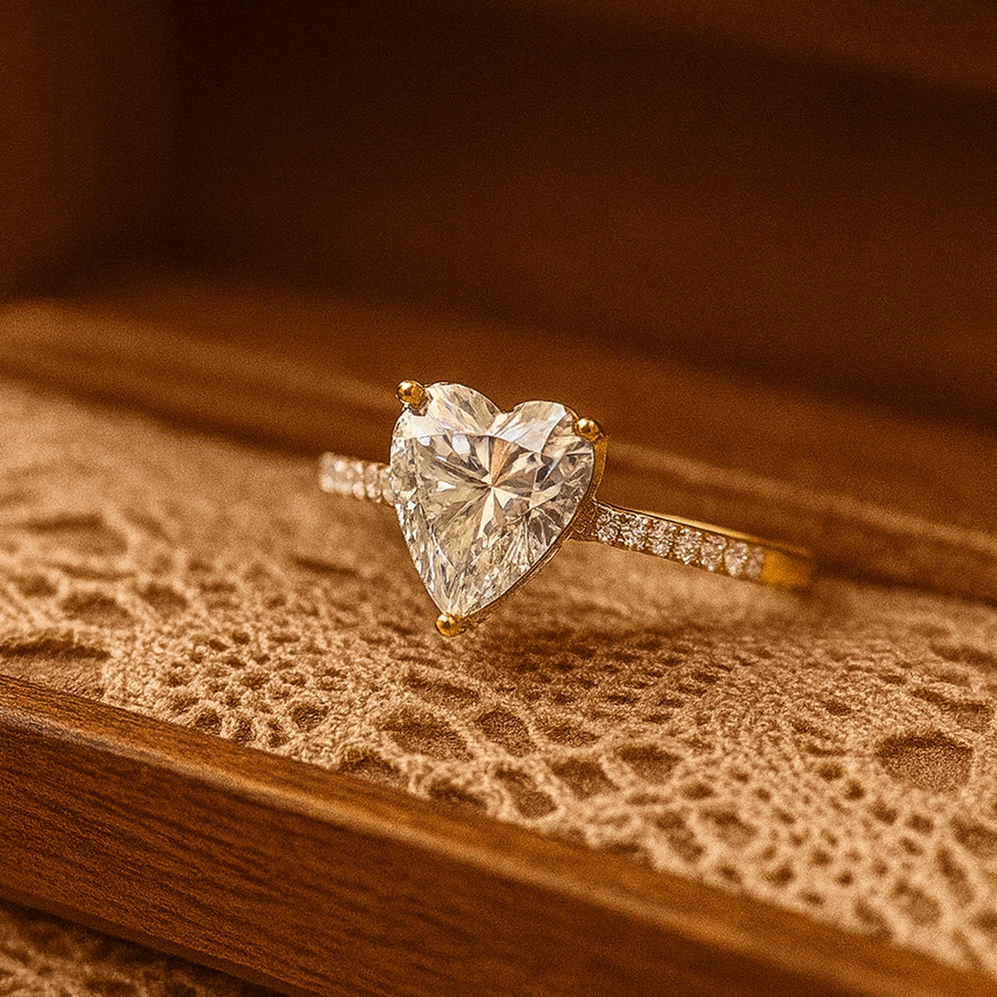 Classic Diiro heart-cut diamond ring in yellow gold with pavé band, elegant and modern style.