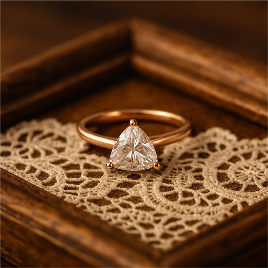Elegant Triangular Cut White Diamond Engagement Ring In 18K Yellow Gold Displayed On Vintage Velvet Jewelry Box.