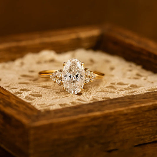 Elegant Oval-Cut Diamond Ring In 14K Yellow Gold With Side Stones.