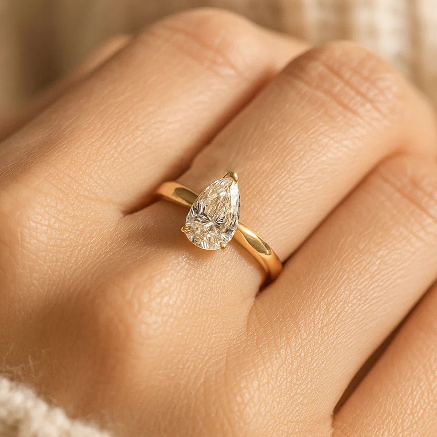 Golden Pear Moissanite Engagement Ring With Classic Setting And Diamond Alternative Appeal.