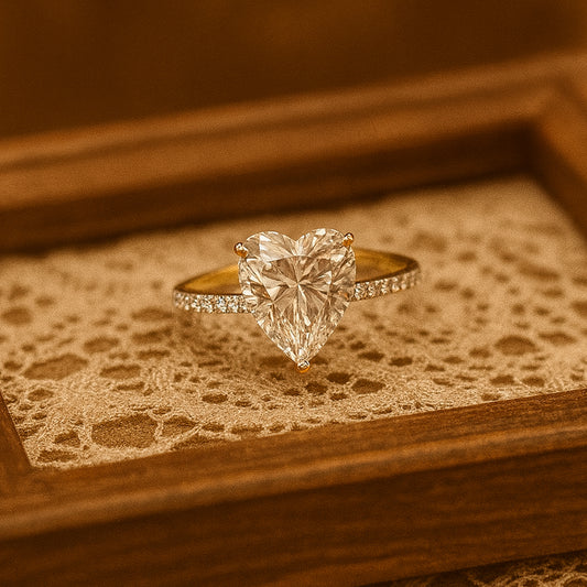 Heart diamond solitaire ring in gold by Diiro, presented in a velvet box for luxury detail