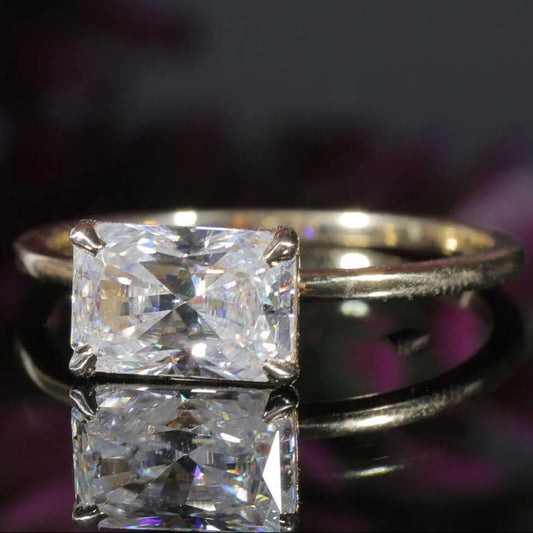 Elegant Moissanite Engagement Ring Featuring Radiant Cut Stone Four-Prong Setting And Exceptional Fire And Brilliance