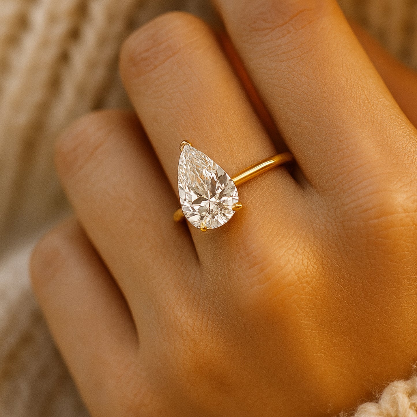 Pear Shaped Moissanite Engagement Ring Resembling Diamond Shine In Luxury Gold Wedding Band.