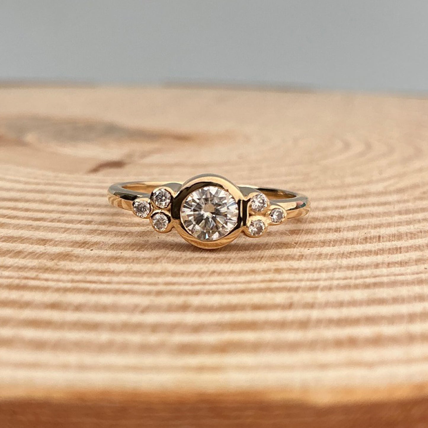 Classic Round Moissanite Ring With Modern Square Setting And Ribbed Band Available In Gold Options