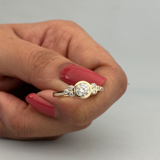 Round Cut Moissanite Engagement Ring With Square Prong Setting And Ribbed Band In White Gold