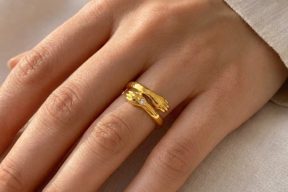 Luxury gold knot engagement ring featuring a delicate diamond accent and polished finish