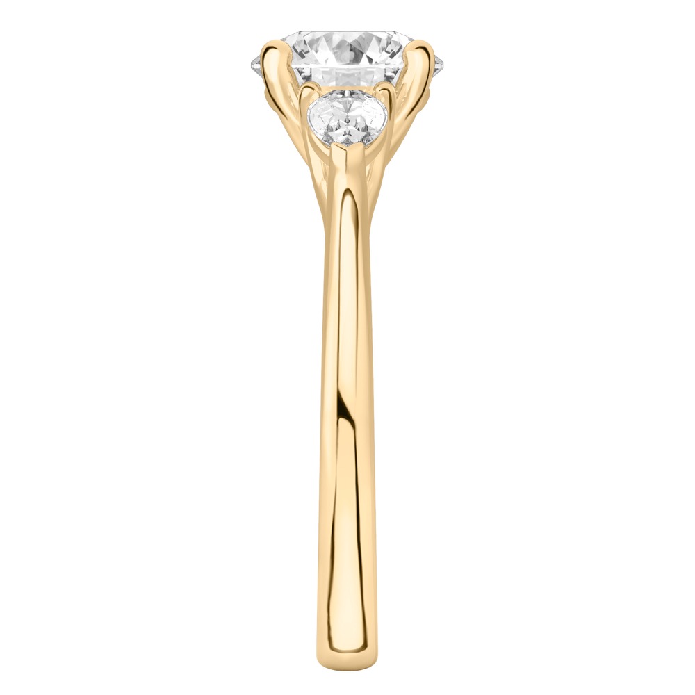 Round Cut Center Stone Set In A Tapered Yellow Gold Band.
