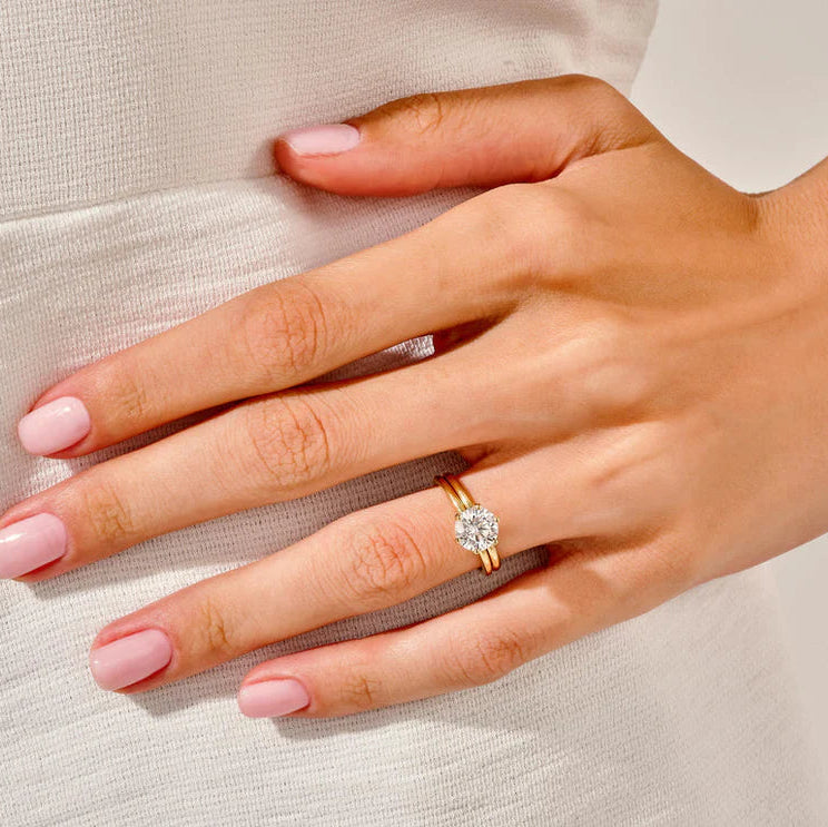 Round cut solitaire diamond ring with classic band
