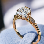 Square Step Cut Diamond Ring With Round Cut Side Stone Cathedral Setting.
