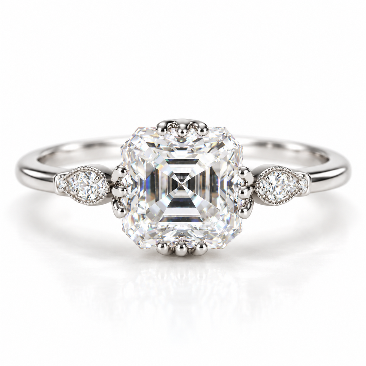 Polished silver Asscher cut engagement ring with a large step cut center stone, pear shaped diamond side accents, and delicate milgrain detailing on a slim band.