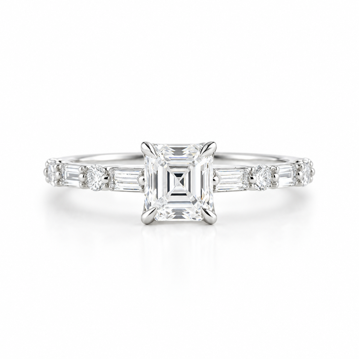 Emerald cut diamond engagement ring in polished silver with a four-prong setting, alternating baguette and round diamond side stones, and a pavé band.