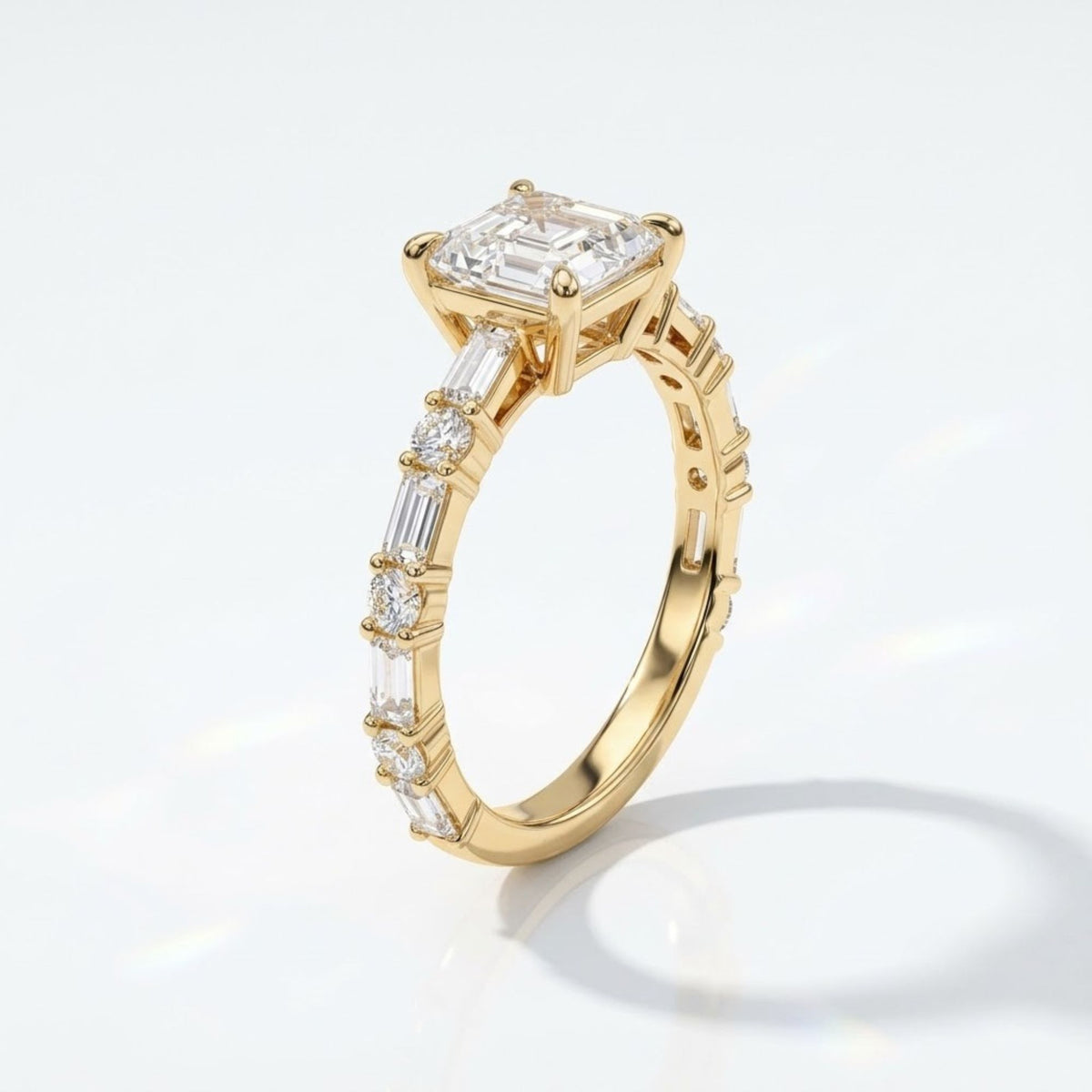 Perspective view of an Asscher cut diamond engagement ring in yellow gold featuring a band set with alternating round brilliant and baguette cut side stones.