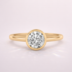 Elegant Gold Bezel Engagement Ring Featuring A Secure And Modern Setting.