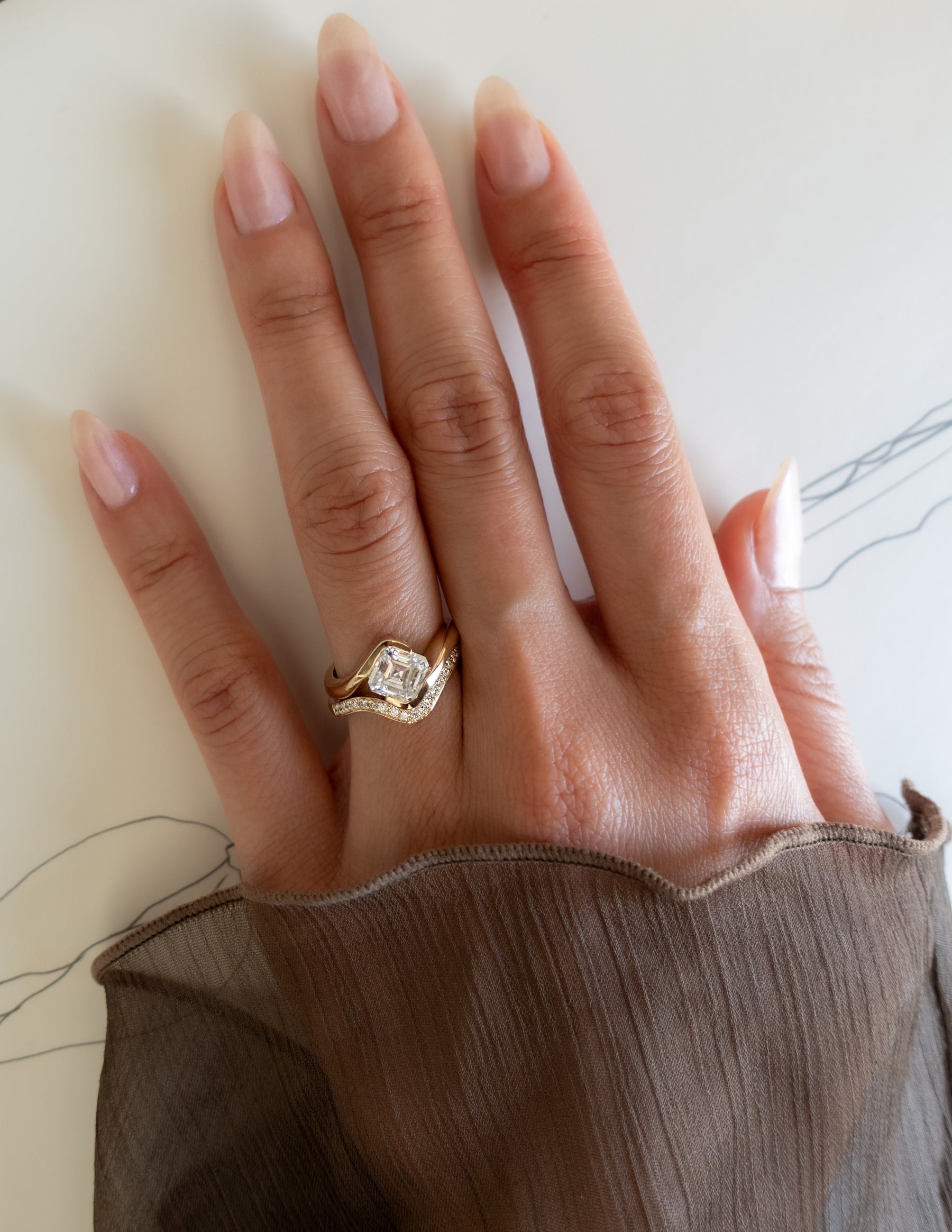 Asscher Cut Ring With Pavé Diamond Guard And Sculptural Design