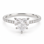 A silver-toned diamond engagement ring featuring a large heart-shaped center diamond and a pavé-set band with small round diamonds, shown on a clean white background.