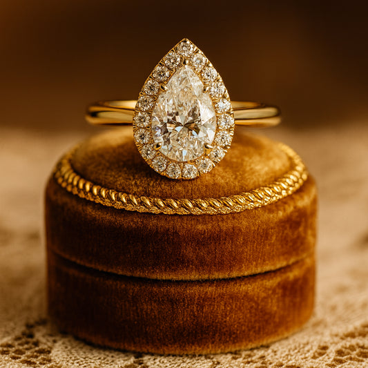 Pear Shape Halo Moissanite Ring In 10K Rose Gold Featuring A Brilliant Diamond-Like Center Stone And Radiant Halo Design