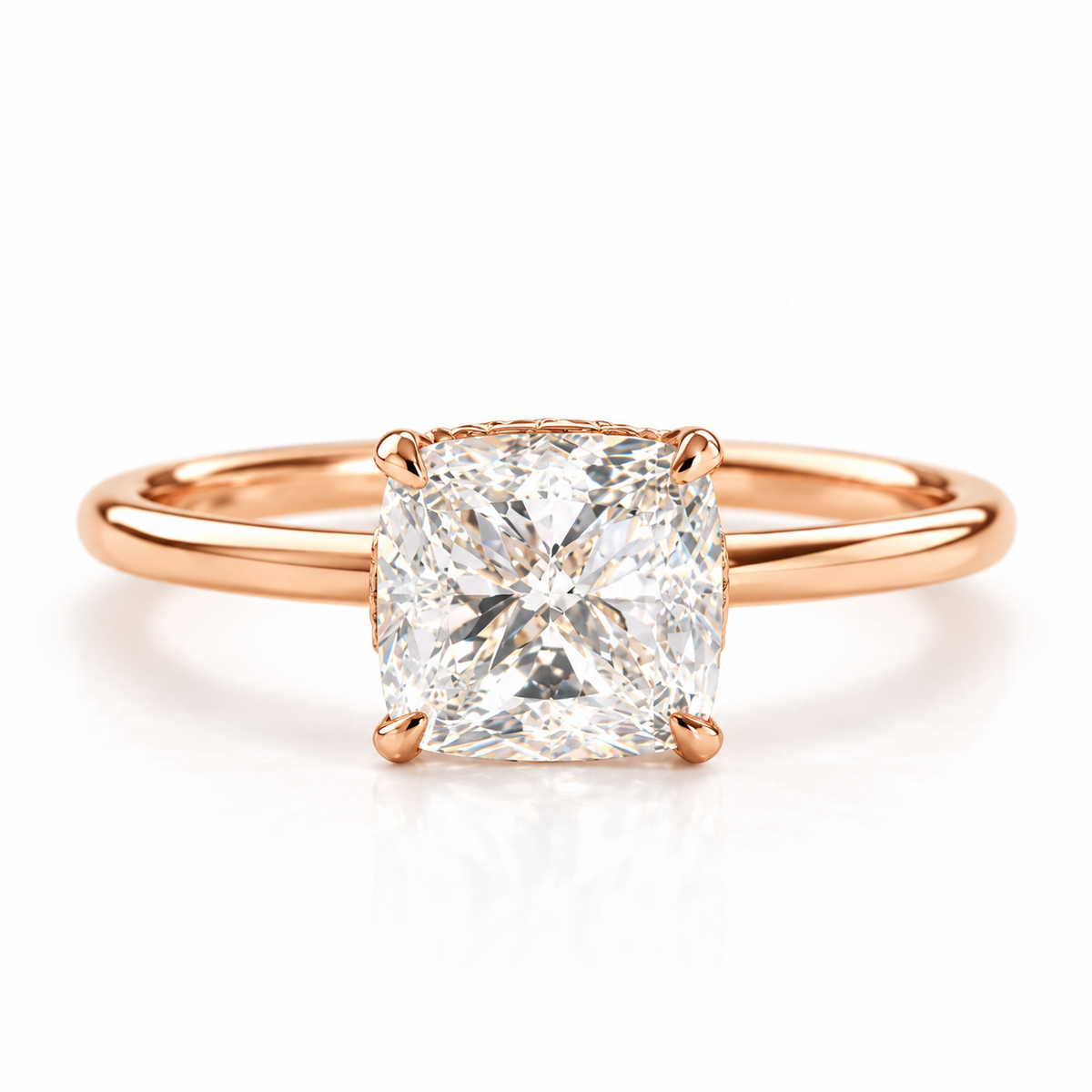 18K rose gold vermeil cushion cut solitaire engagement ring with a large sparkling center stone and polished slim band