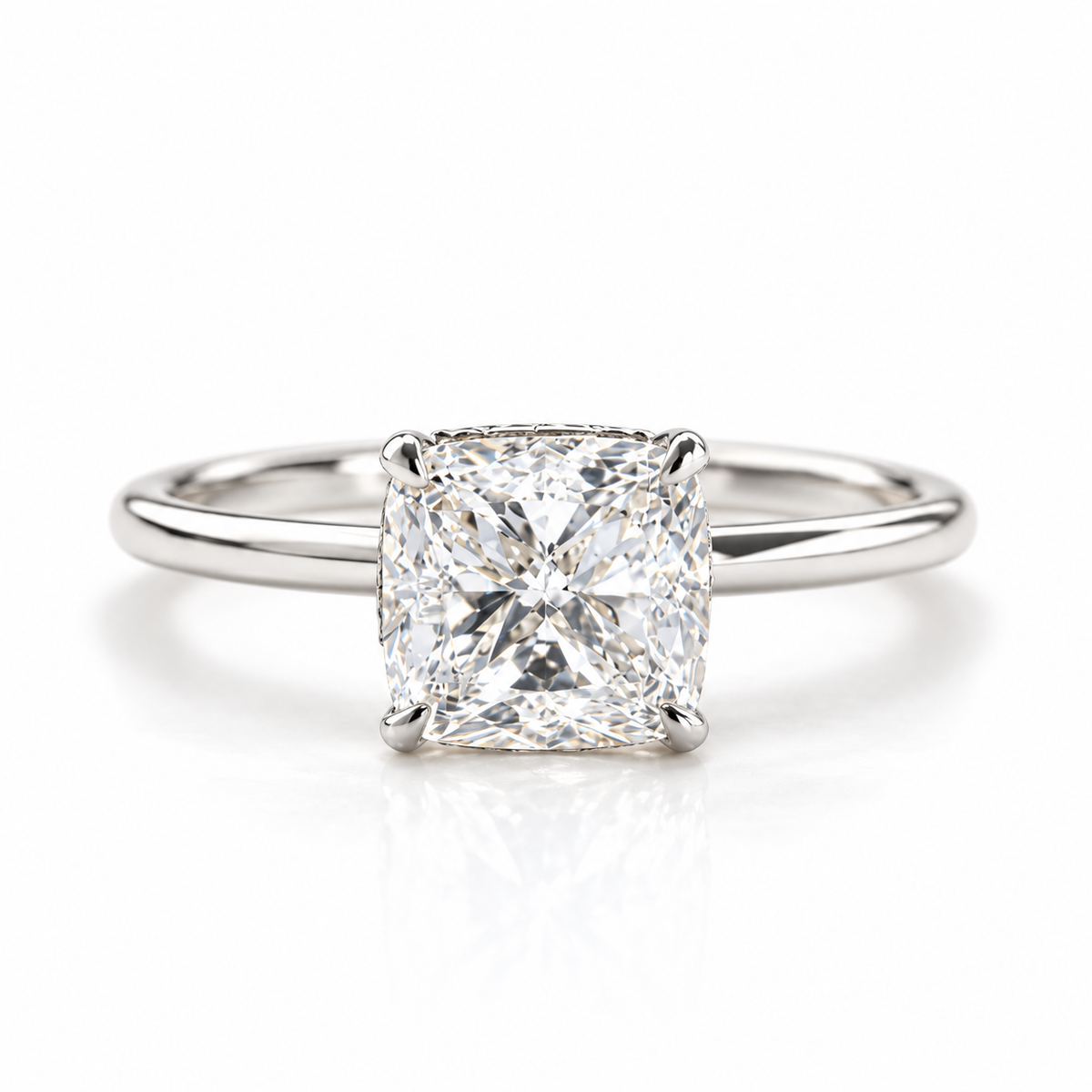 Polished silver cushion cut solitaire engagement ring with a large sparkling center stone and sleek slim band