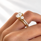 Side angle of a cushion cut ring stone showing its depth and brilliant facets, with a round accent stone beside it