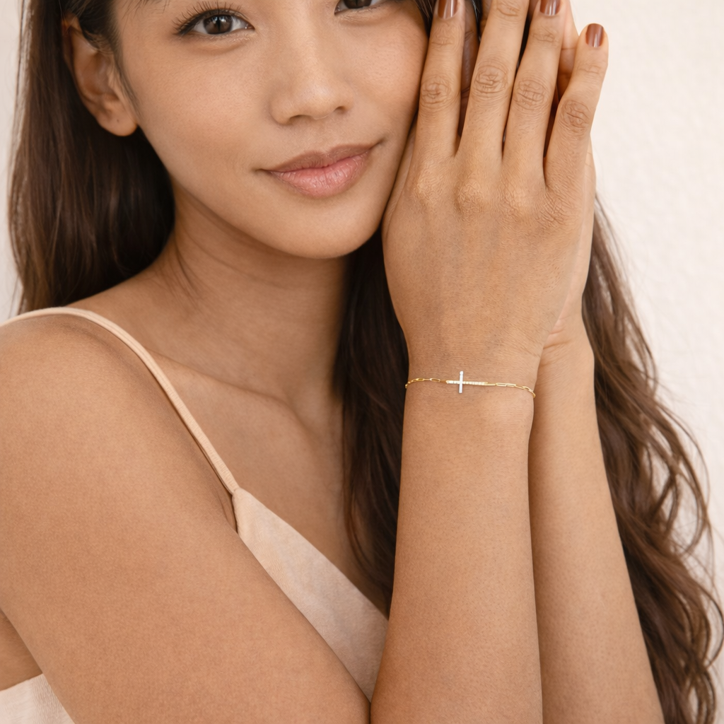Paperclip bracelet with cross charm design
