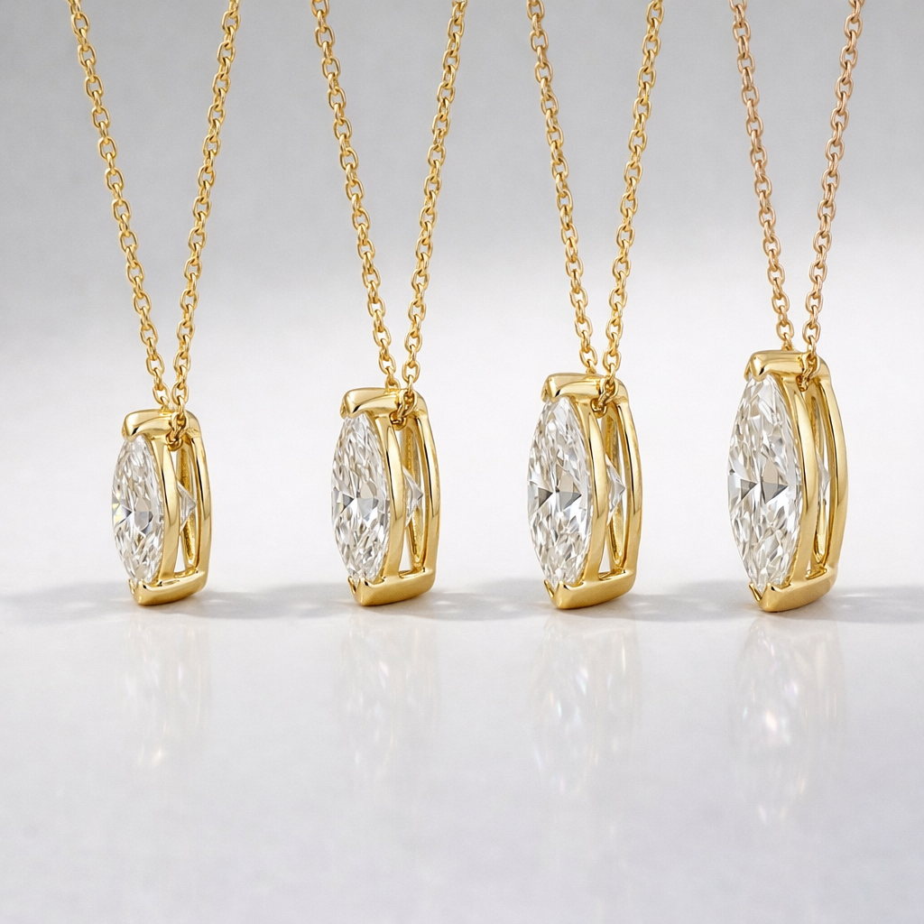 Round-Cut Diamond In 14K Gold Cross Pendant With Four-Prong Setting.
