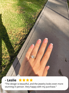 Yellow gold oval cluster engagement ring on hand, with 4-star customer review from Leslie