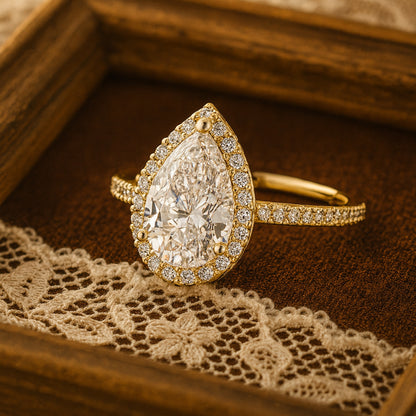 Pear Shaped Moissanite Engagement Ring In 18K Yellow Gold With Halo And Pave Design Radiating Diamond-Like Fire