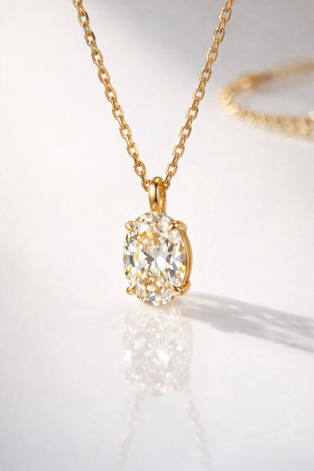 Dainty Oval Diamond Pendant In Yellow Gold With A Secure Prong Setting.
