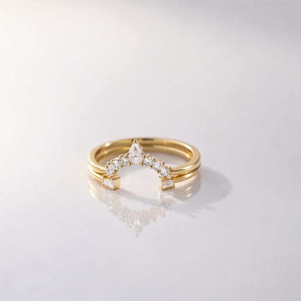 U Shaped Open Wedding Band With Round And Pear Cut Diamonds In Gold
