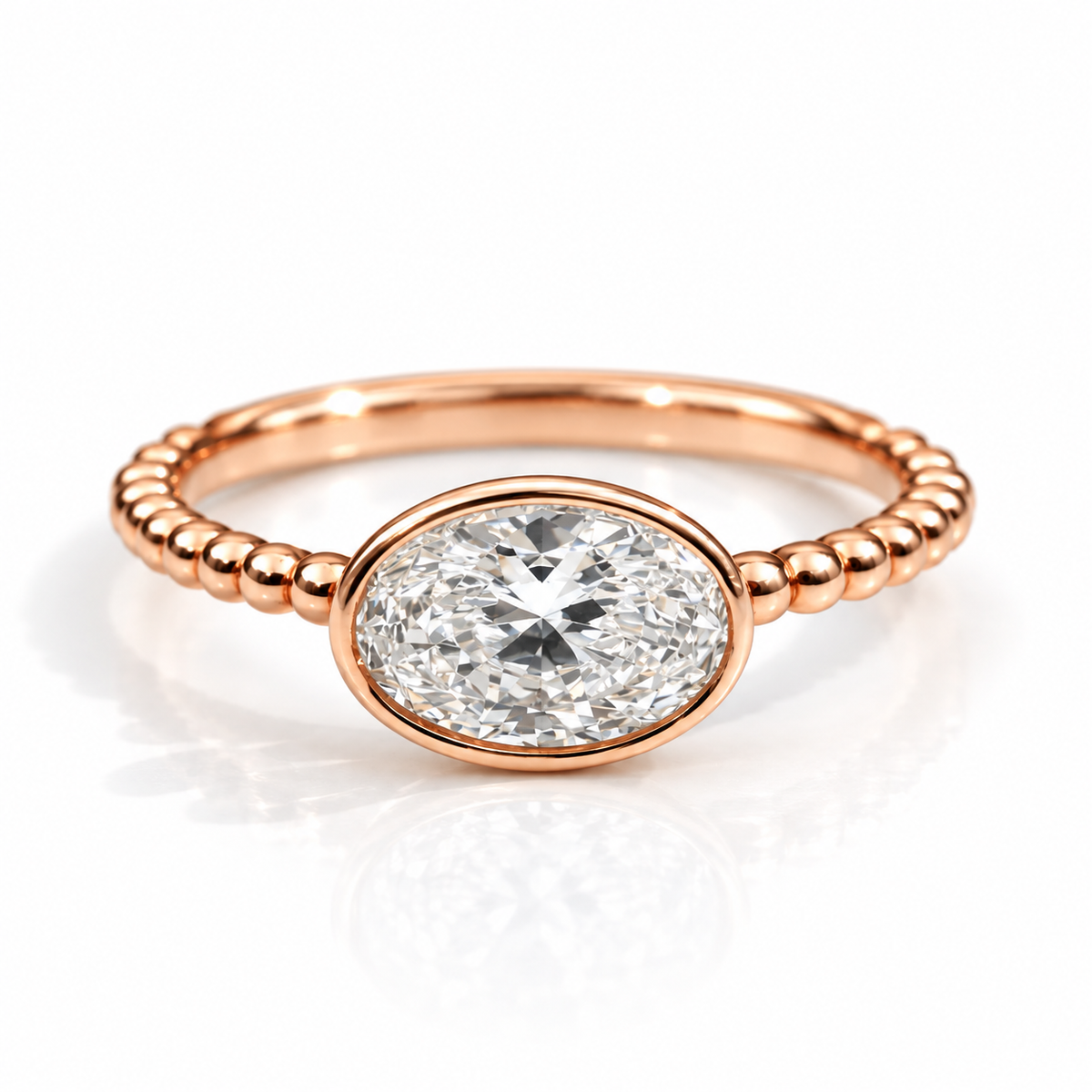 18K rose gold vermeil oval gemstone ring with a bezel setting and beaded band