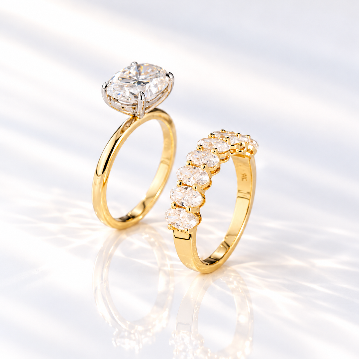 Front view of an east west oval cut clear ring stone with sharp brilliant facets and bright white sparkle