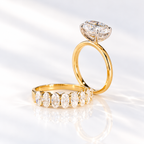 Profile of an east west oval cut colorless ring stone showing its stone depth and four-prong setting