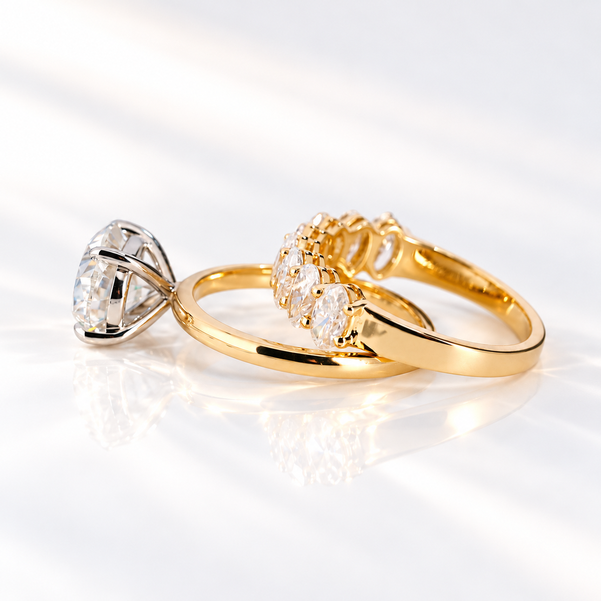 Side angle of a horizontally set oval cut ring stone showing its depth, brilliant facets, and prong setting