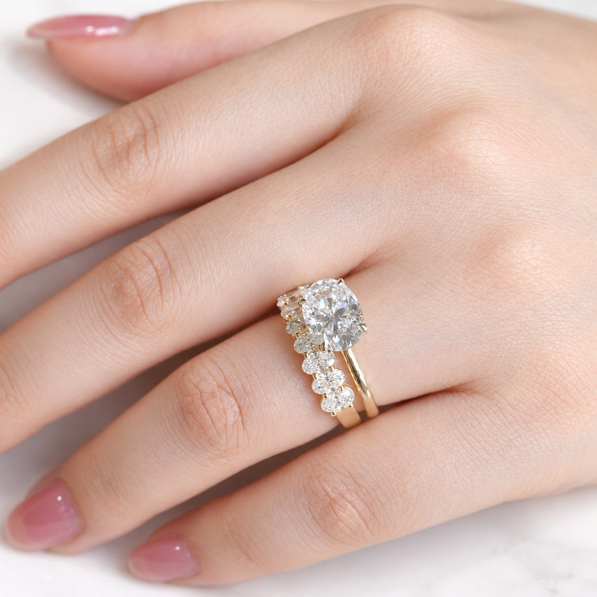 East west oval cut colorless ring stone with a wide horizontal shape and bright faceted sparkle
