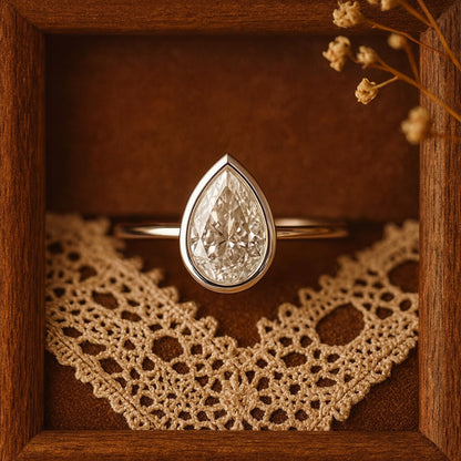 14K White Gold Pear Bezel Moissanite Diamond Engagement Ring Promise Ring Jewelers Near Me 
