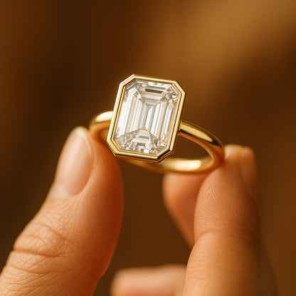 Elegant Emerald Cut White Diamond Engagement Ring In 18K Yellow Gold Displayed On Vintage Jewelry Box
