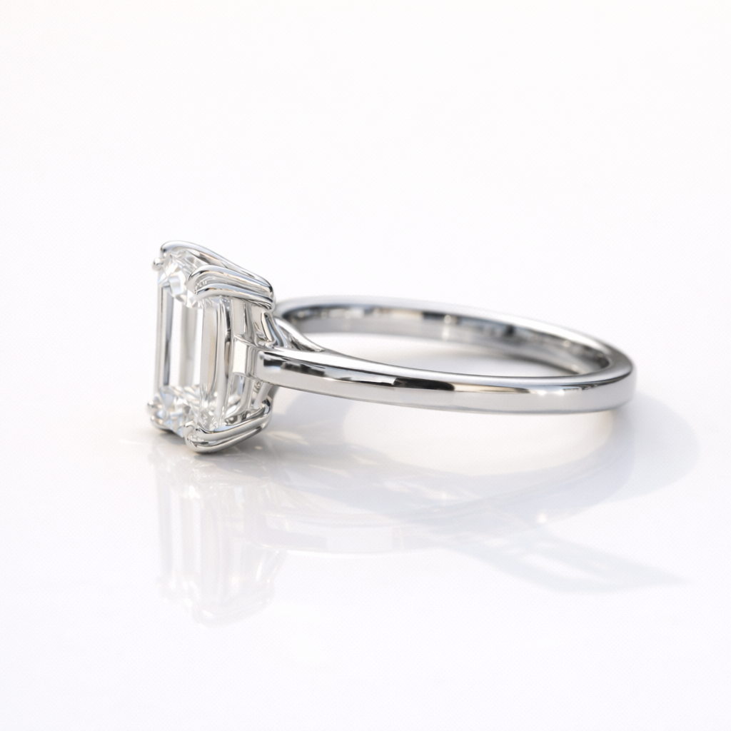 Emerald Cut Solitaire Ring With Elegant Double Claw Prongs Design
