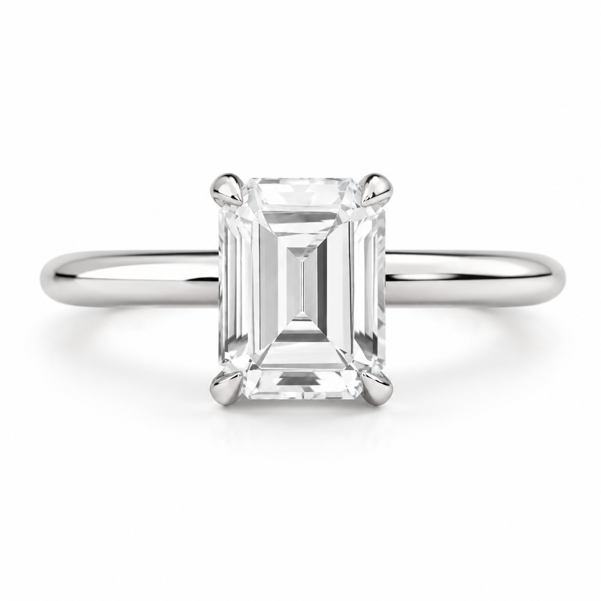 Silver emerald cut diamond engagement ring with elegant solitaire setting
