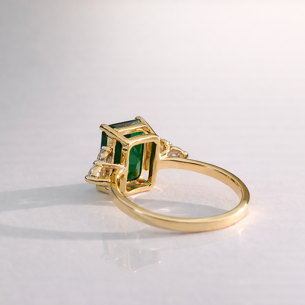 Gold Emerald Cut Engagement Ring Round Cut Side Stone Diiro.
