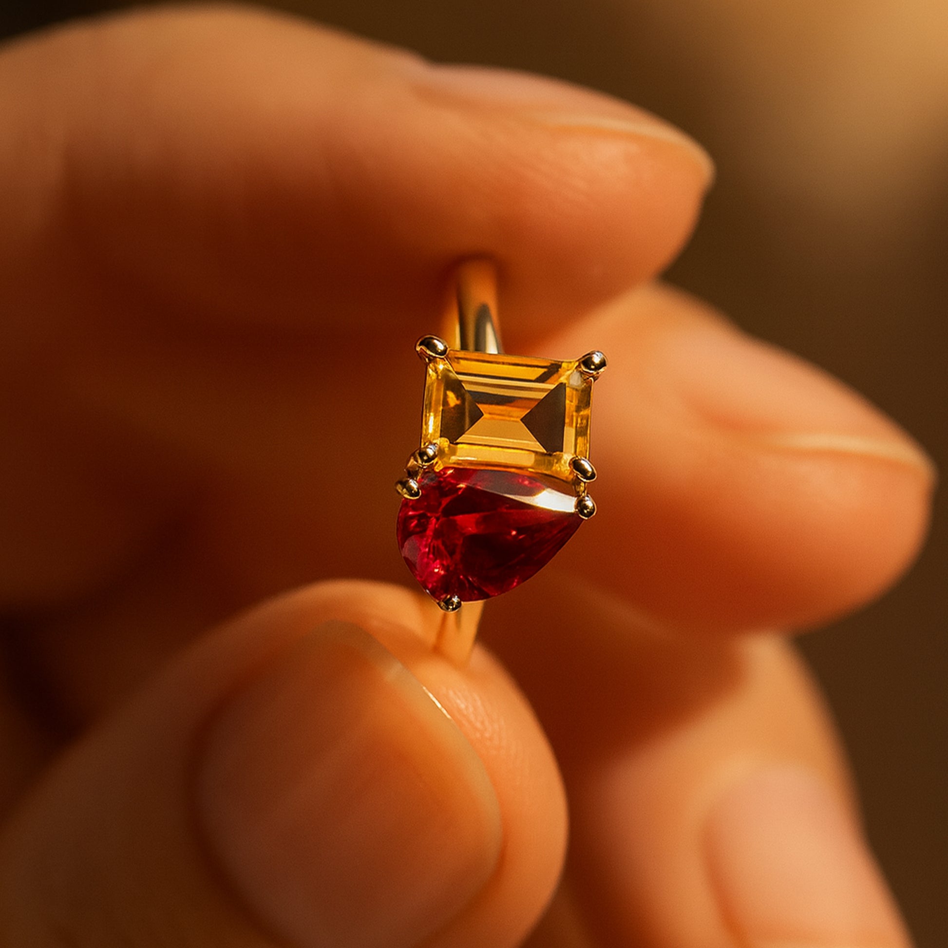 Two Stone Ruby And Yellow Sapphire Gold Ring On Hand