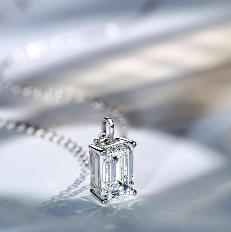 Solitaire Pendant With Emerald Cut Diamond Pendant And Four Round Prong Setting
