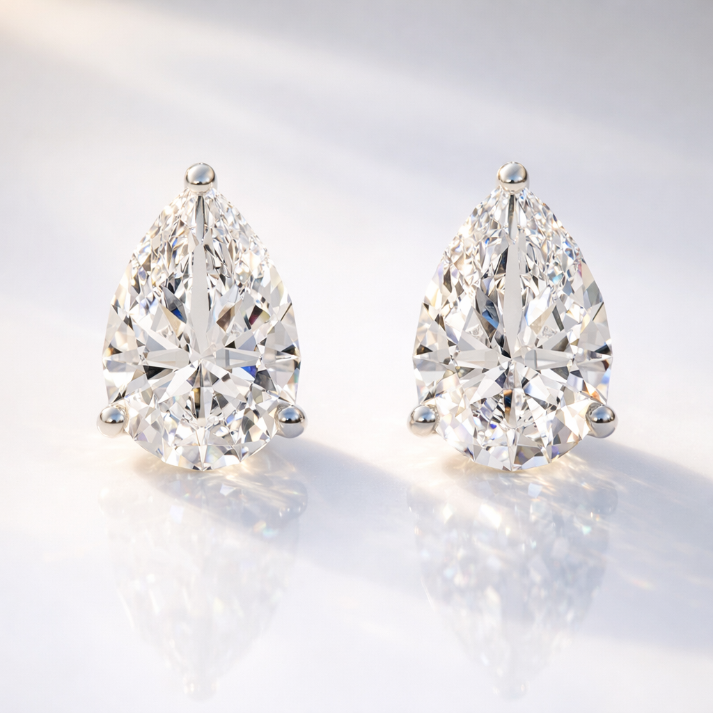 Diiro Earrings Featuring Pear Cut Teardrop Diamond Studs
