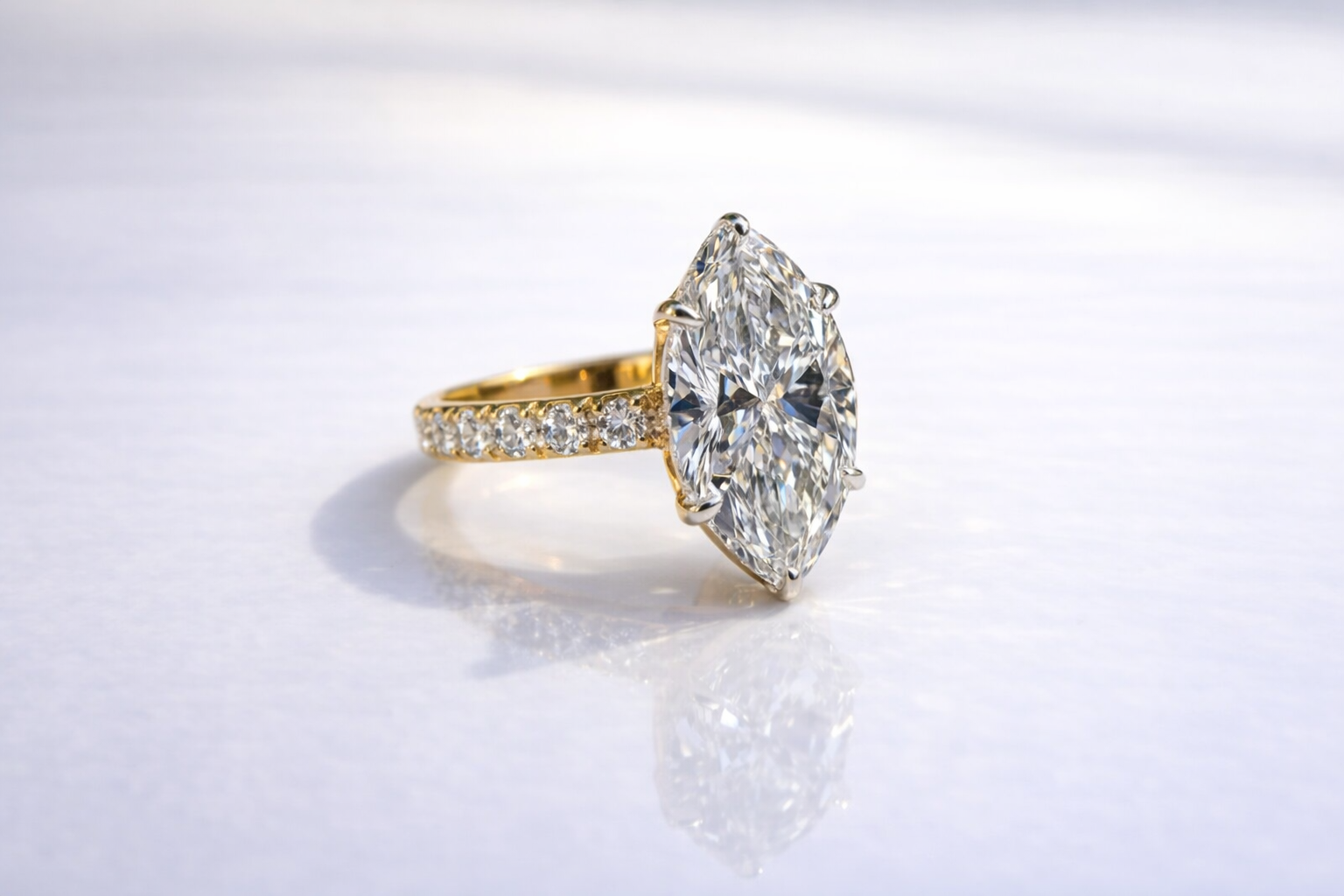 Marquise Cut Engagement Ring Featuring Round Cut Side Stone Ring
