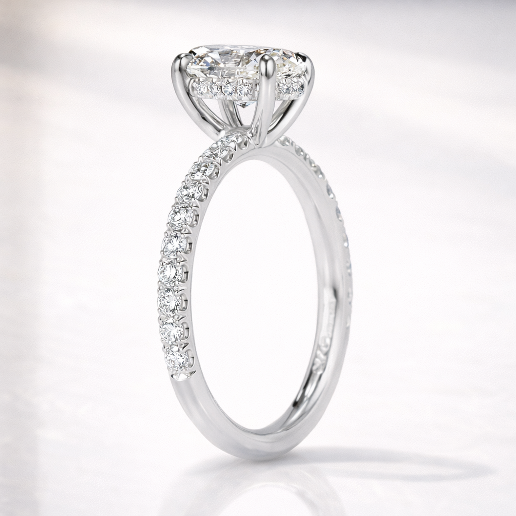 Oval Cut Moissanite Ring Featuring Hidden Halo And Pavé Band
