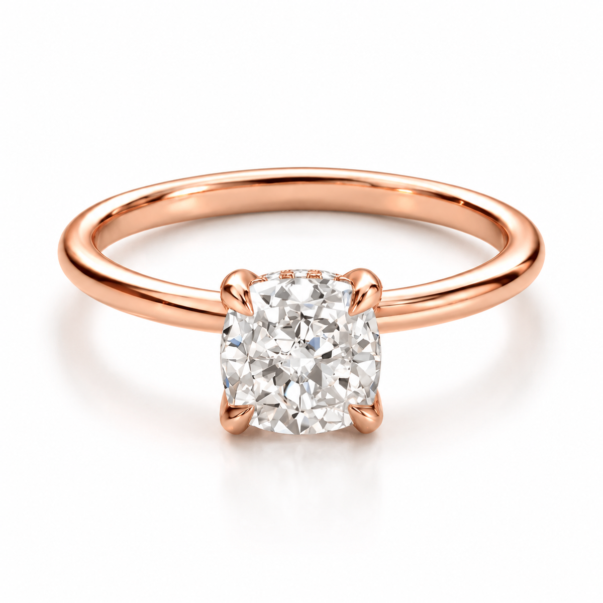 18K rose gold vermeil solitaire engagement ring featuring a cushion-cut diamond with four-prong setting, polished rose gold band, and elegant luxury fine jewelry design on a white background.