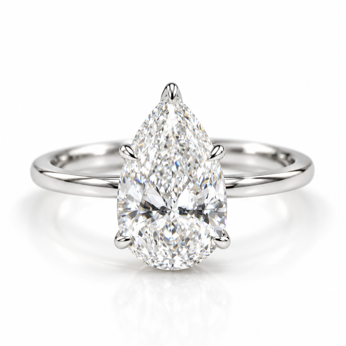 Polished silver pear cut diamond solitaire engagement ring with sleek band