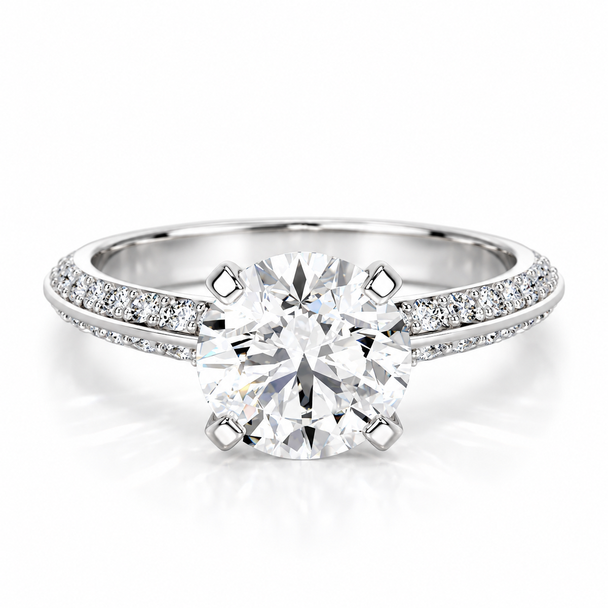 Round brilliant cut diamond engagement ring in polished silver with a double pavé diamond band and four-prong solitaire setting.
