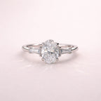 Oval Cut Moissanite Ring with Tapered Baguette Side Stone
