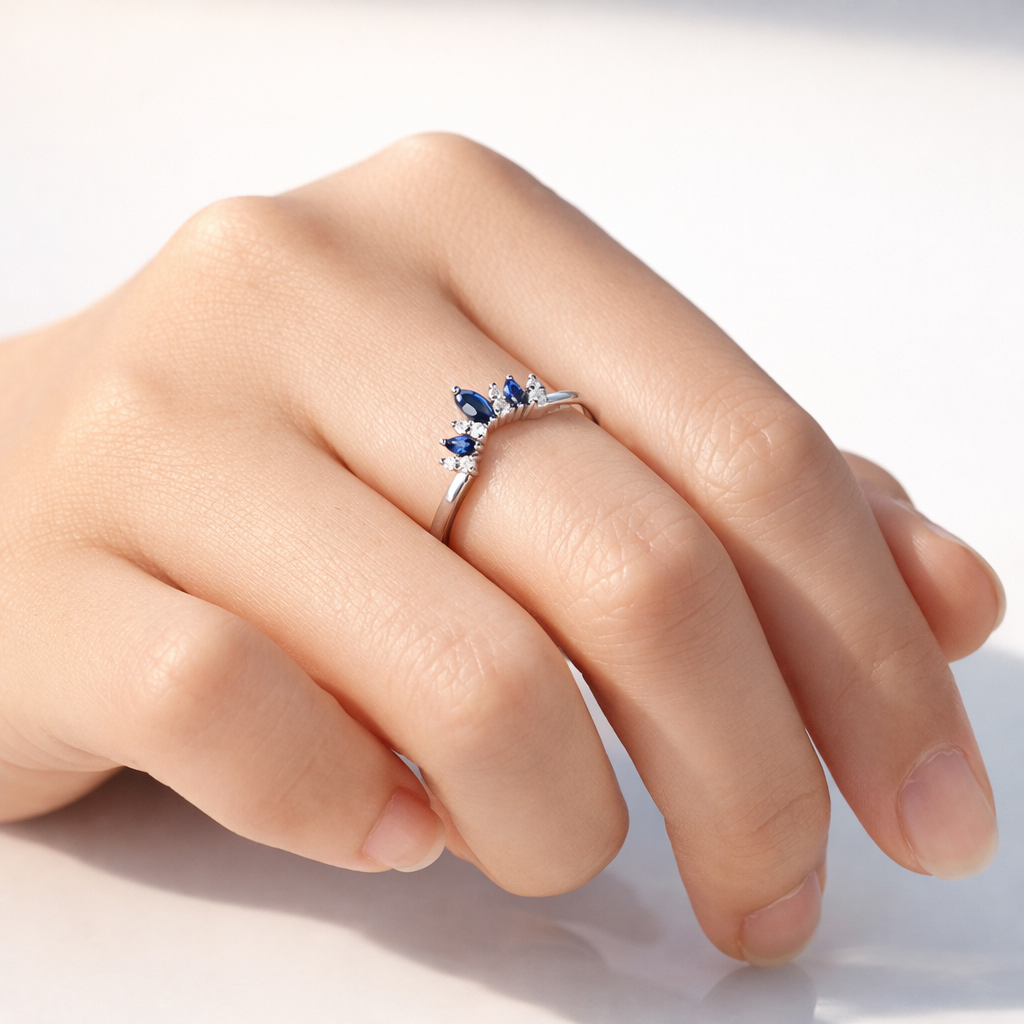 Blue Sapphire Curved Wedding Band With Diamond Accents
