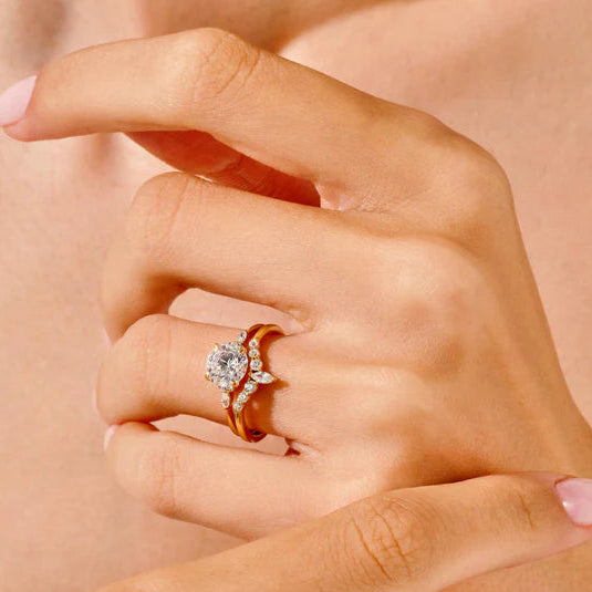 Round cut diamond ring with marquise side stones

